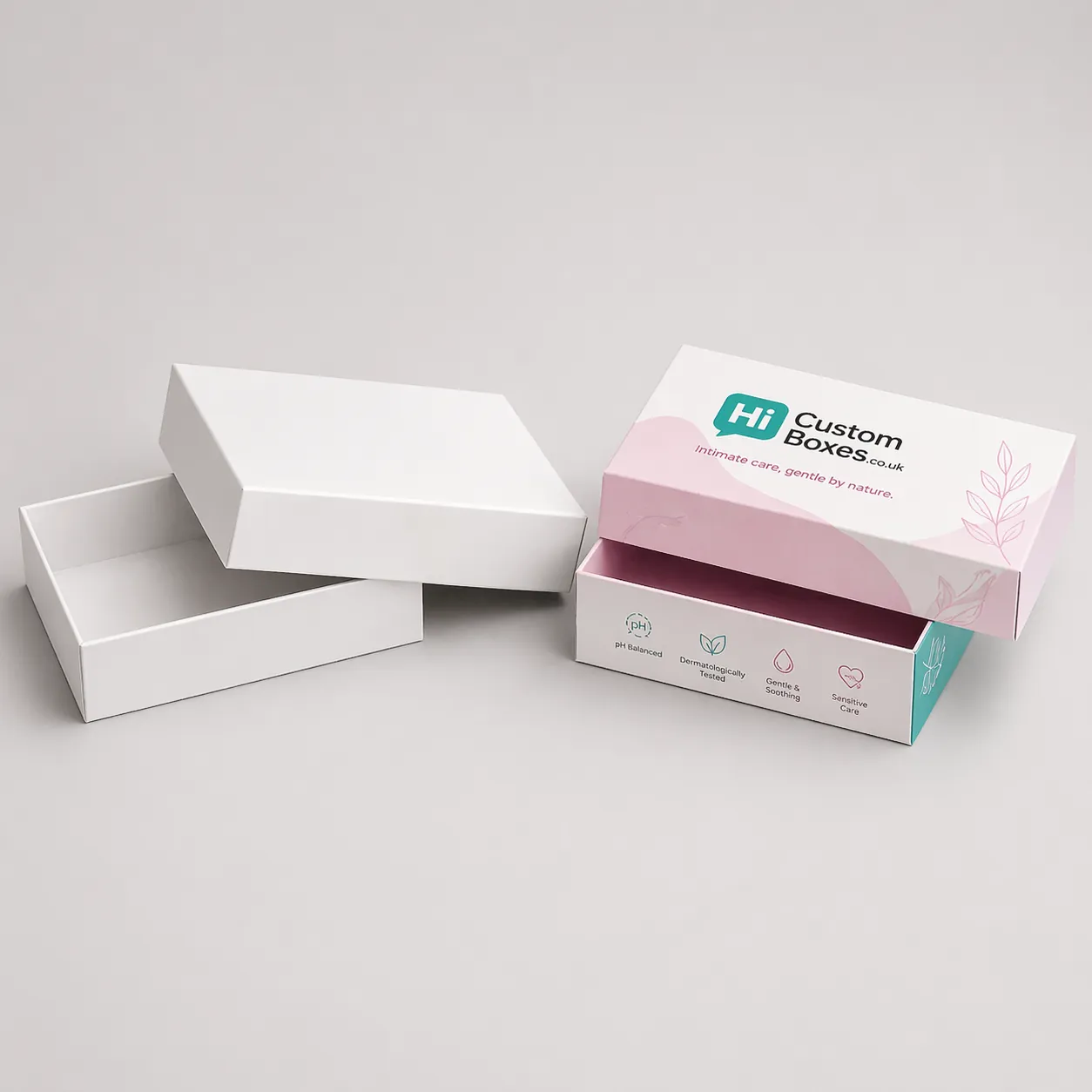 An open and closed purple floral branded box designed for intimate cream tube packaging. class=